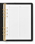 An open black leather-bound ring binder planner showing May and June undated Notairé calendar pages with gold-tone metal rings on a white background.